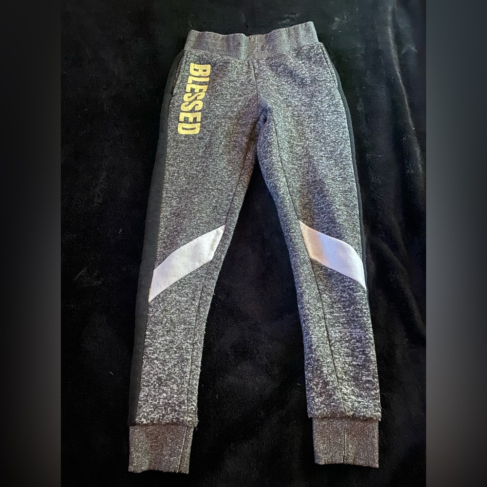 Grey blesses swats, comes with pockets.